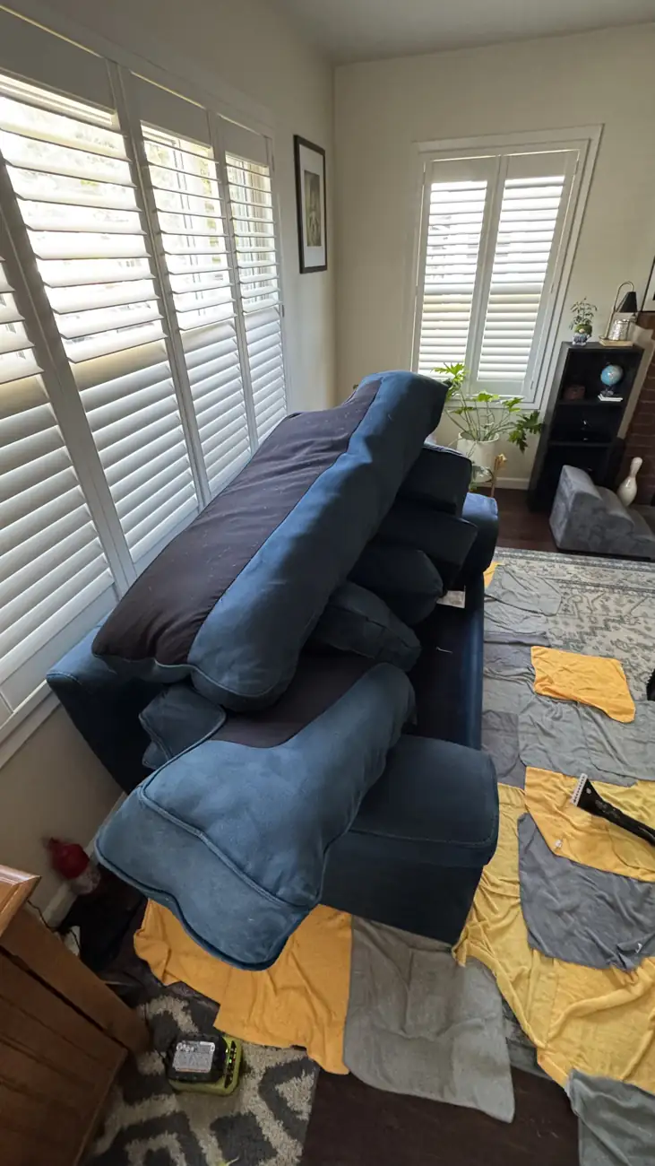Blue velvet recliners opened up for cleaning including the footrests
