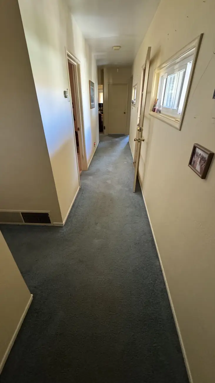 Hallway carpet in a Palo Alto home before and during cleaning