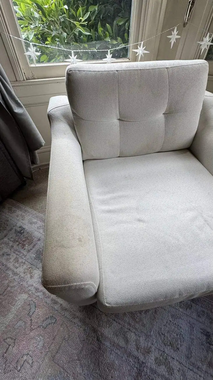 Light armchair before cleaning, soiled seat and salt deposits