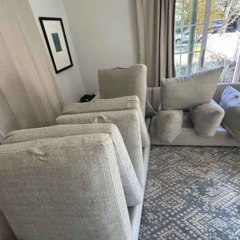 Cream sectional cushions removed before upholstery cleaning