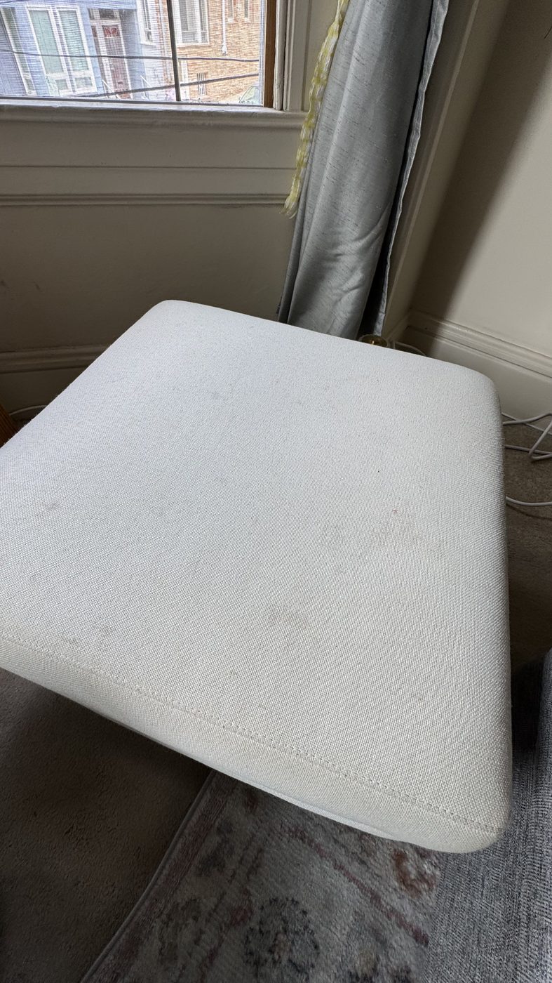 Light ottoman after deep cleaning in a San Francisco apartment