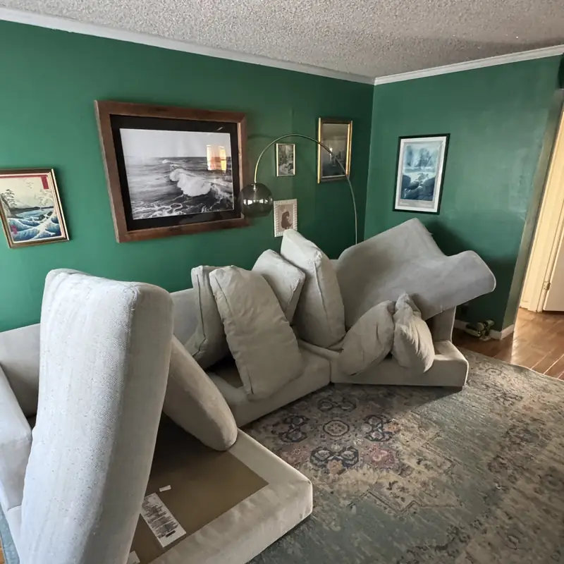 Cream sectional with cushions removed during upholstery cleaning