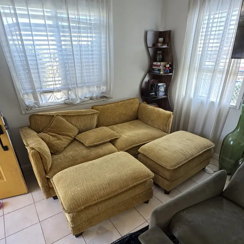 Five-piece living room set prepared for upholstery cleaning