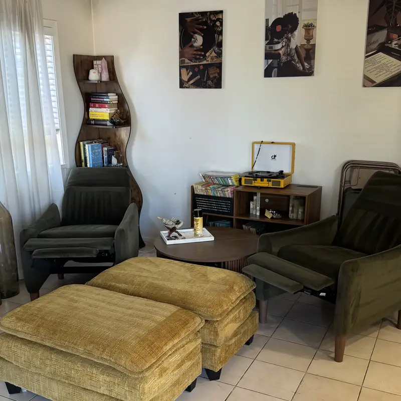 Ottoman and recliners in the living room before cleaning