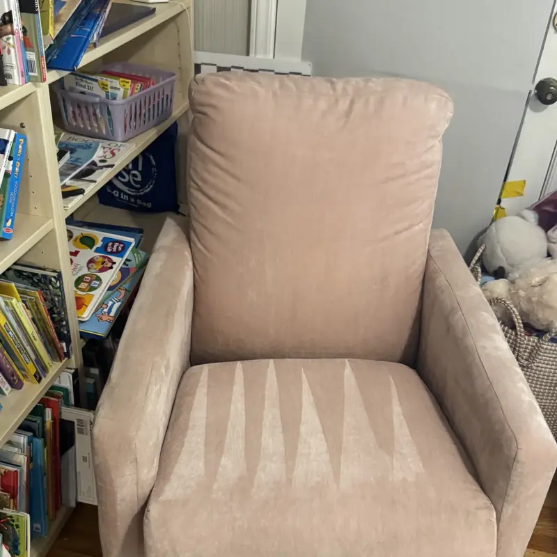 Cleaned pink armchair back in the child's room