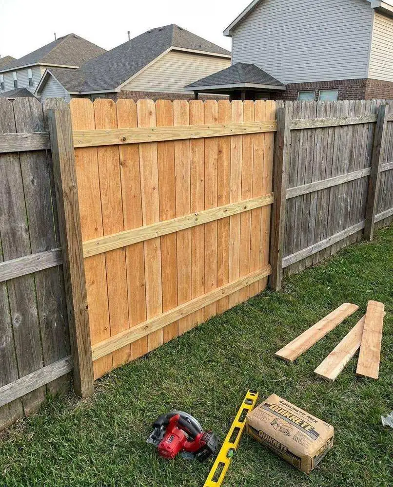 Repaired wooden fence