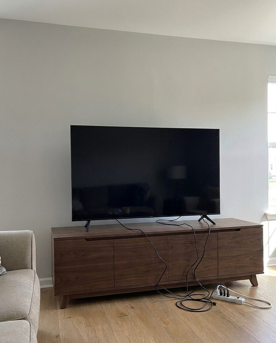 TV standing on a media console before mounting
