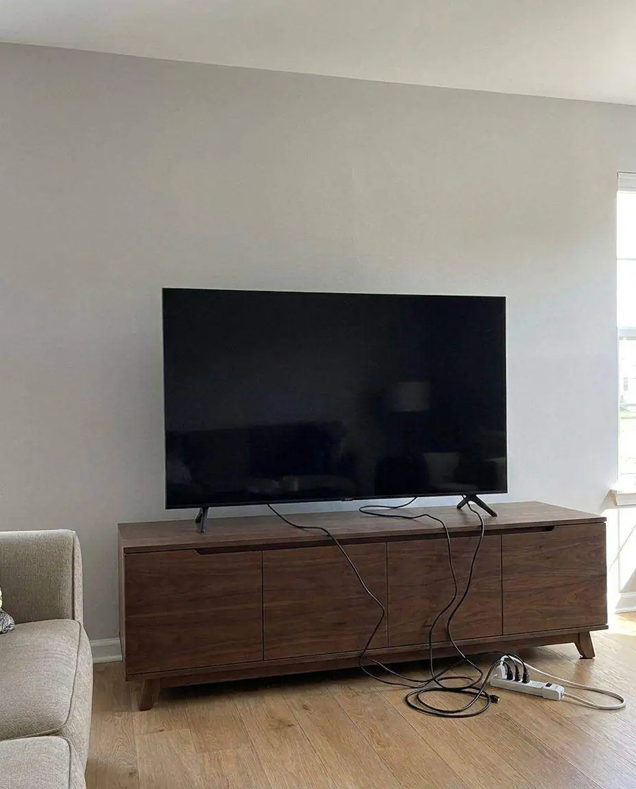 TV standing on a media console before mounting